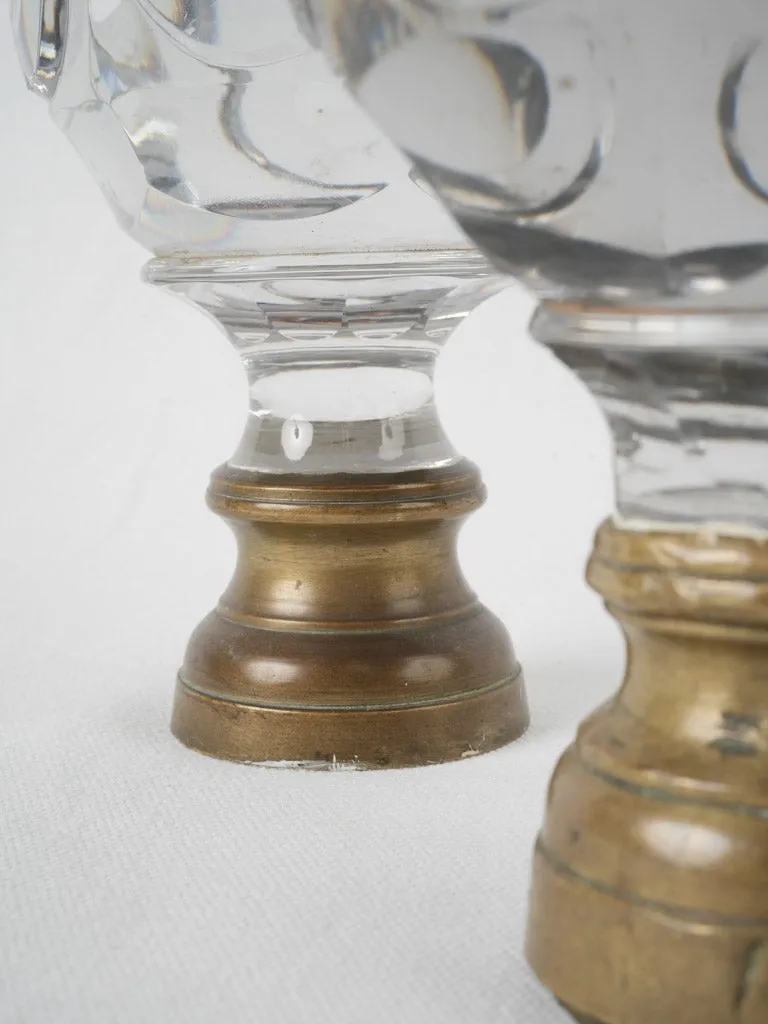 Antique French inexact pair of round clear glass 'Boule d'escalier’ newel caps w/ brass bases 7"