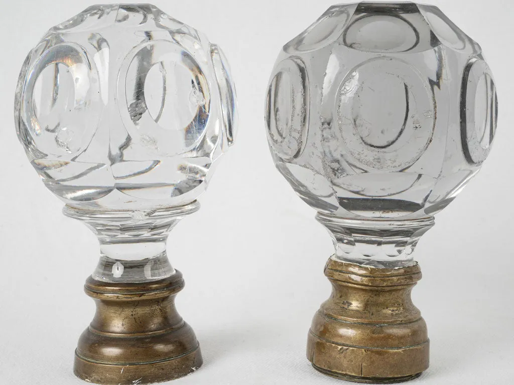 Antique French inexact pair of round clear glass 'Boule d'escalier’ newel caps w/ brass bases 7"